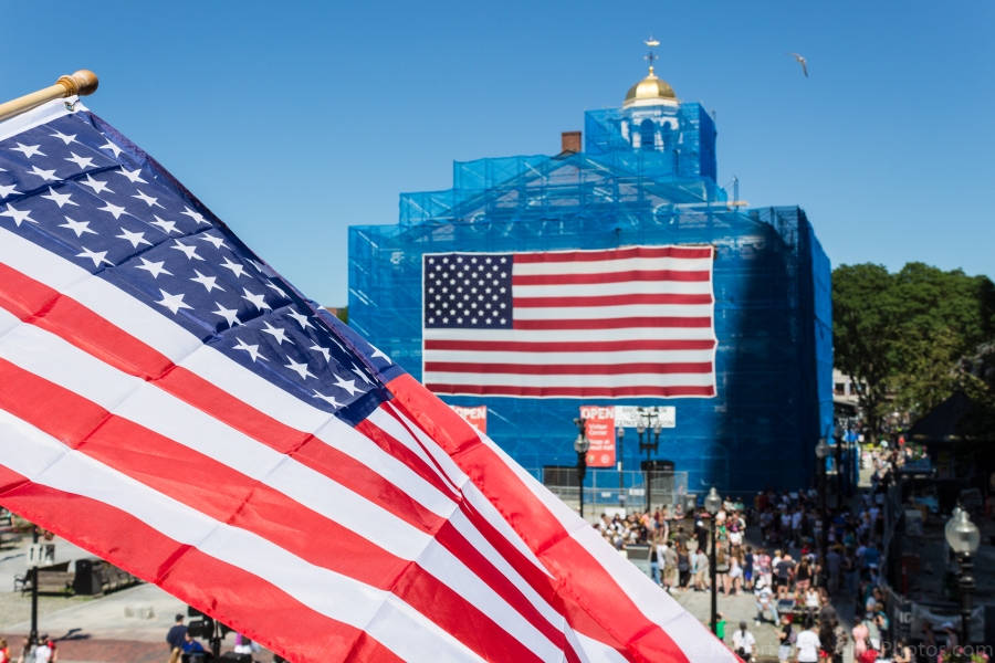34-Faneuil-Hall-Boston-Under-Construction-With-Large-American-Flag-and-Flag-in-Foreground