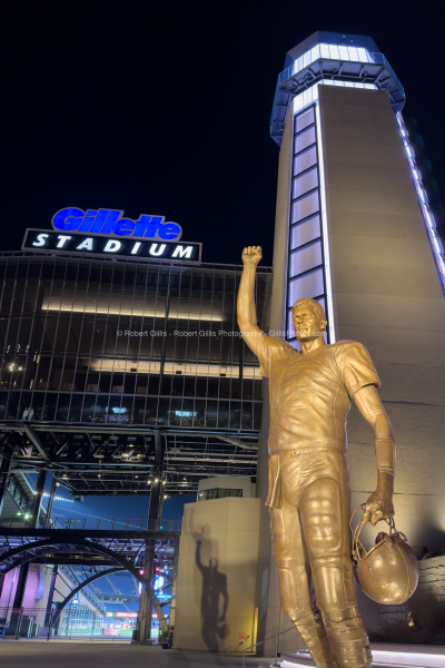 110-Gillette-Stadium-Lighthouse-and-Tom-Brady-Statue-At-Night